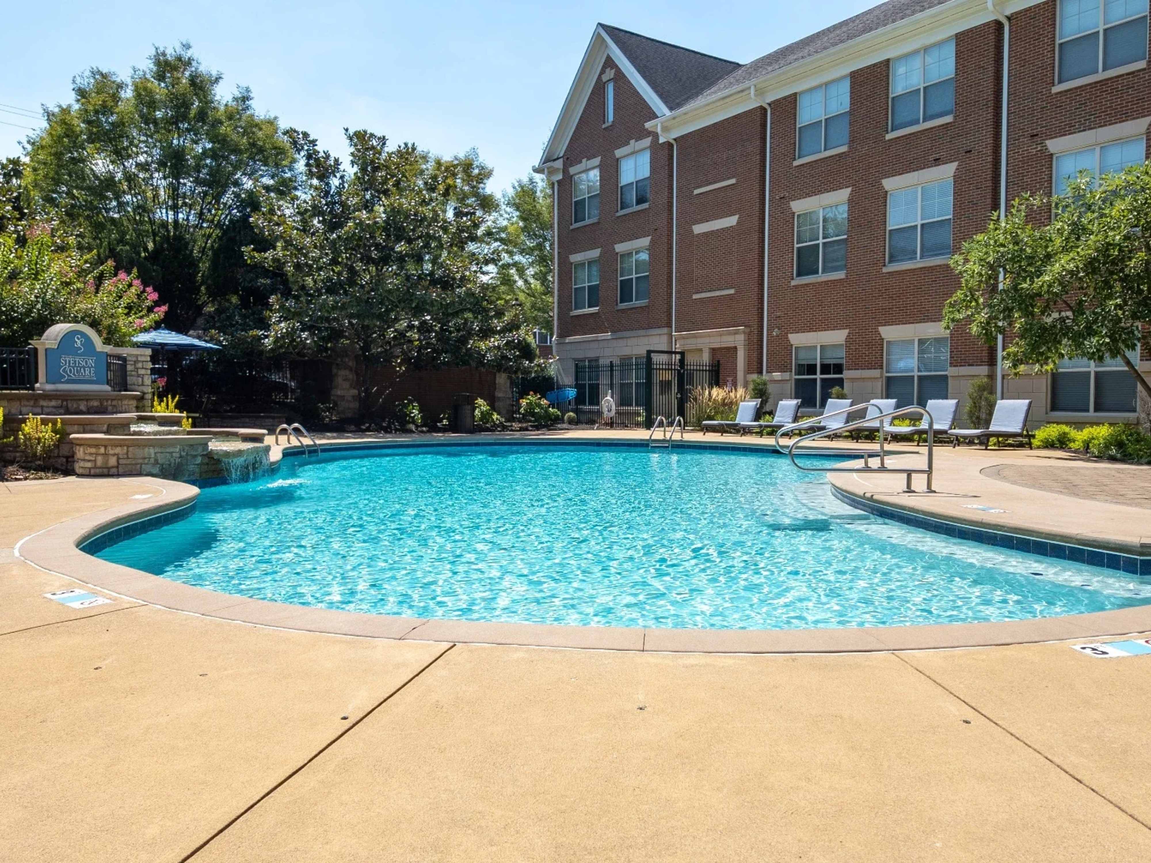 Sparkling swimming pool with waterfall at The Village at Stetson Square in Cincinnati, Ohio