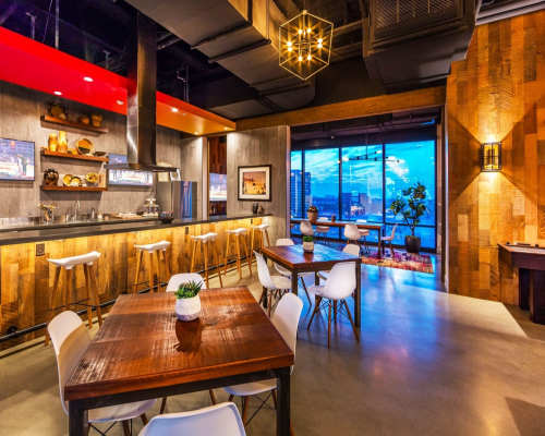 Clubhouse with kitchen and tables at The George Apartment Homes, Anaheim, California