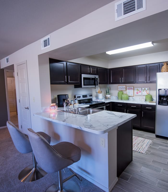 Kitchen with granite countertops at Icon at Hewitt in Hewitt, Texas