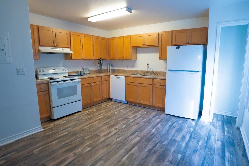 Kitchen with wooden cabinets at Sea Mist Townhomes in Rockport,Texas