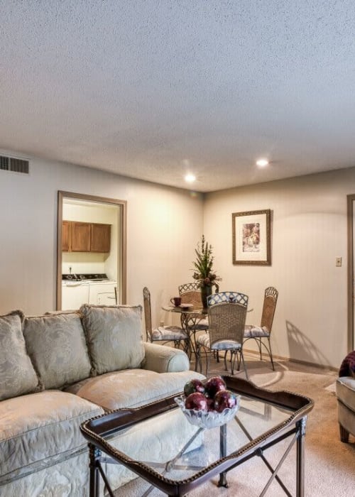 Model living space with coffee table at Sycamore Lake in Memphis, Tennessee