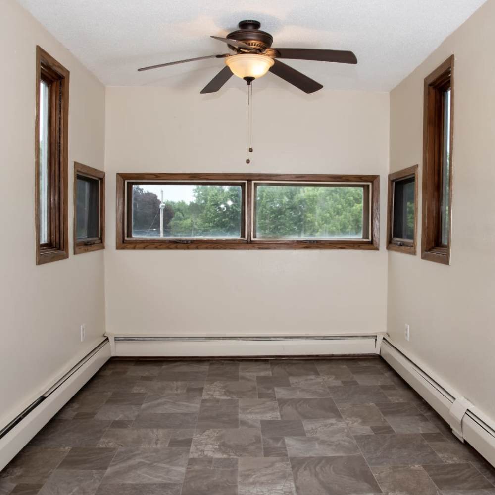 Dining area with windows at Bass Lake Crossing in New Hope, Minnesota
