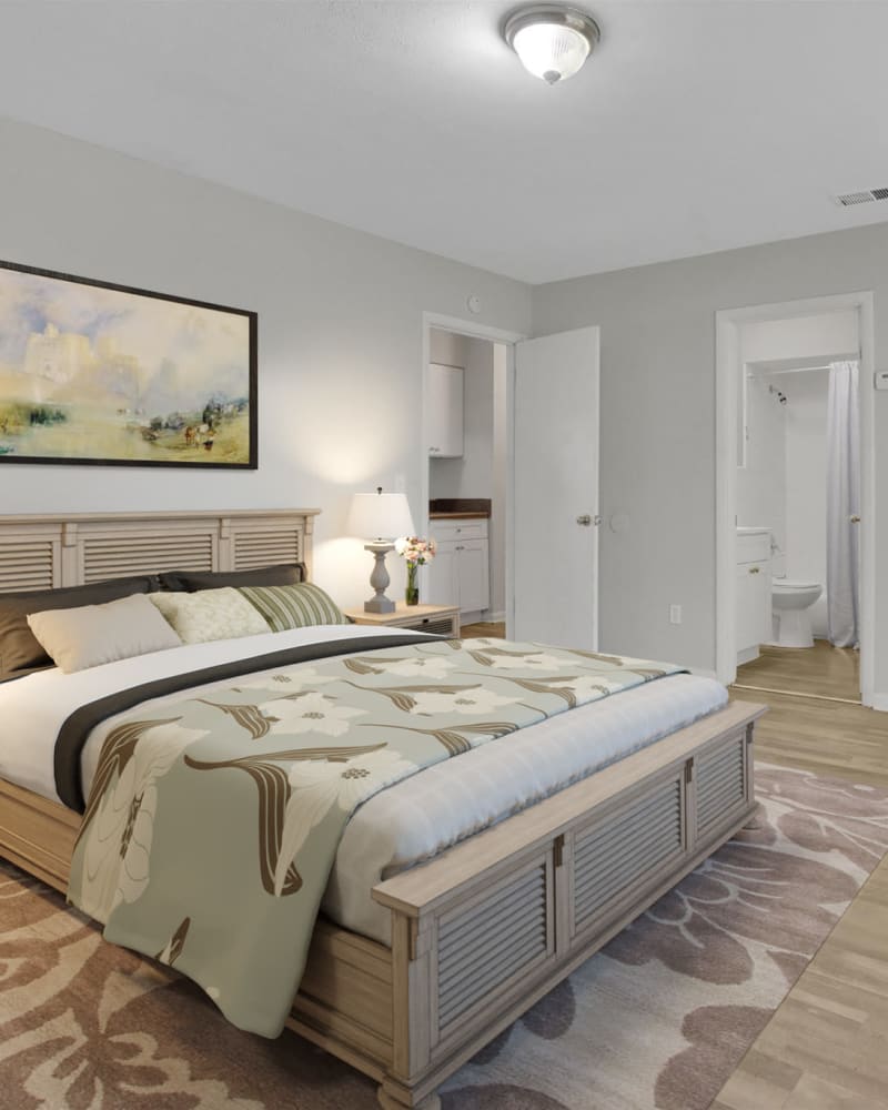 A large bed in a model apartment bedroom at Mason Drive Apartments in Columbus, Georgia