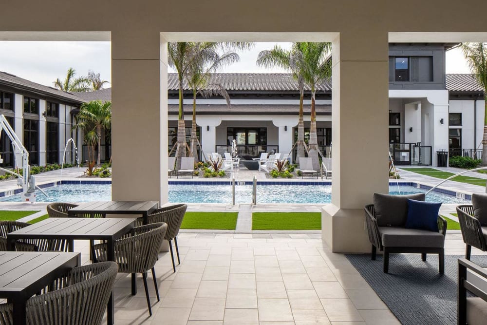 outdoor covered seating next to the pool at Las Palmas in Fort Myers, Florida
