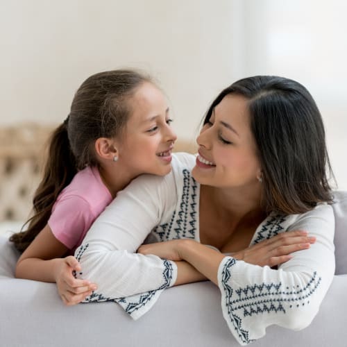 A mother and her daughter relaxing in a home at Naval Amphibious Base in San Diego, California