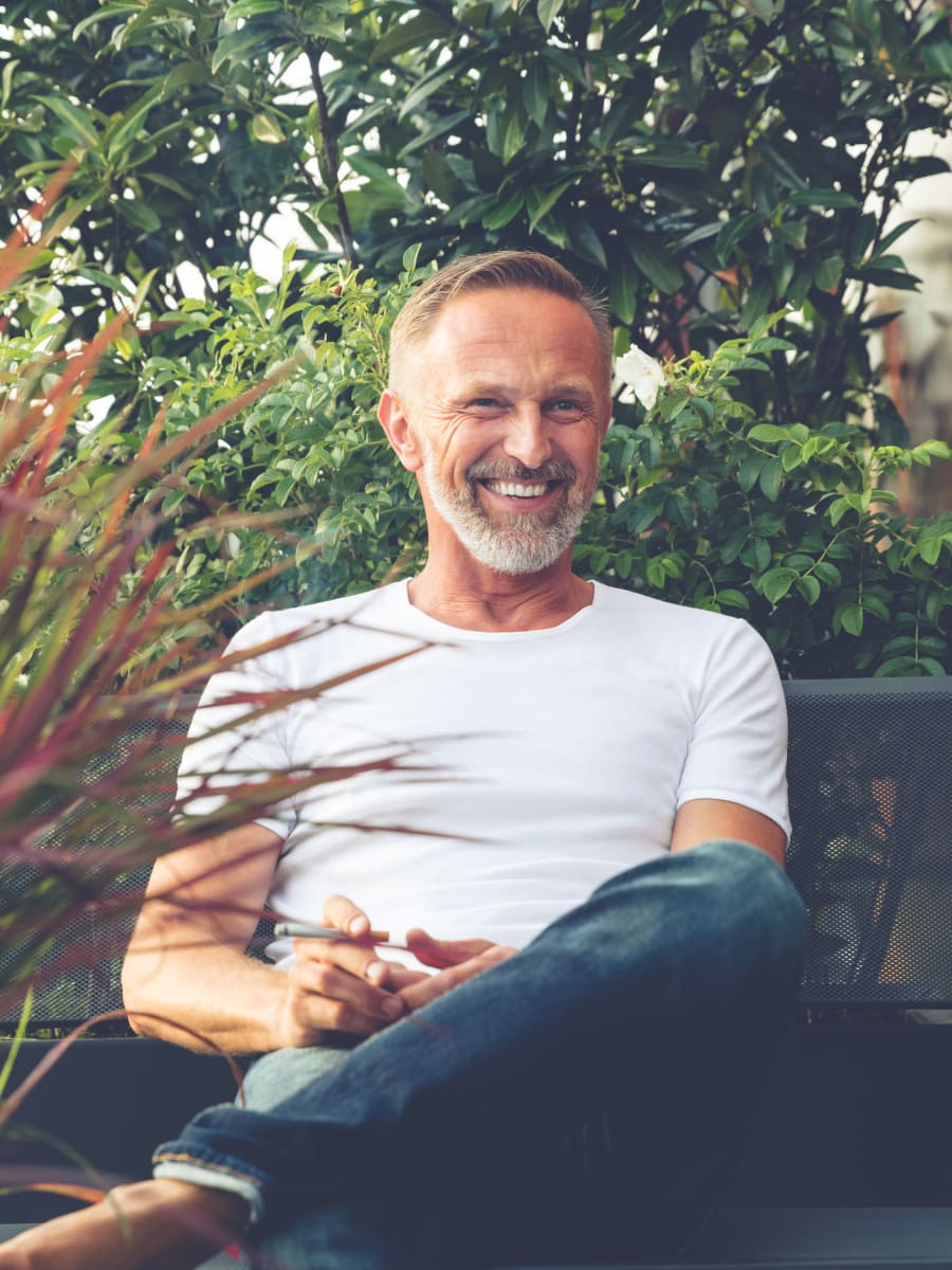 Resident enjoying his personal back porch at The Larstrand in New York, New York