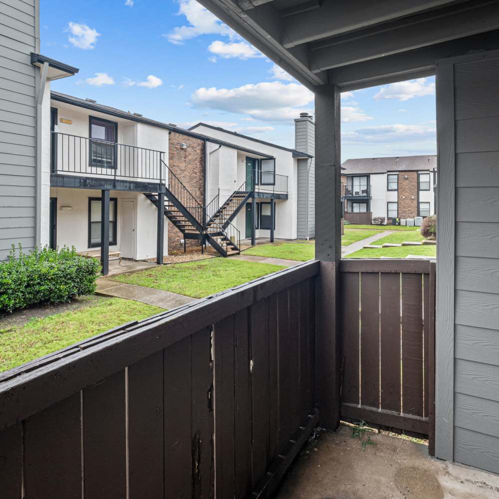 Private patio at Pine Oaks Apartments in Mesquite, Texas