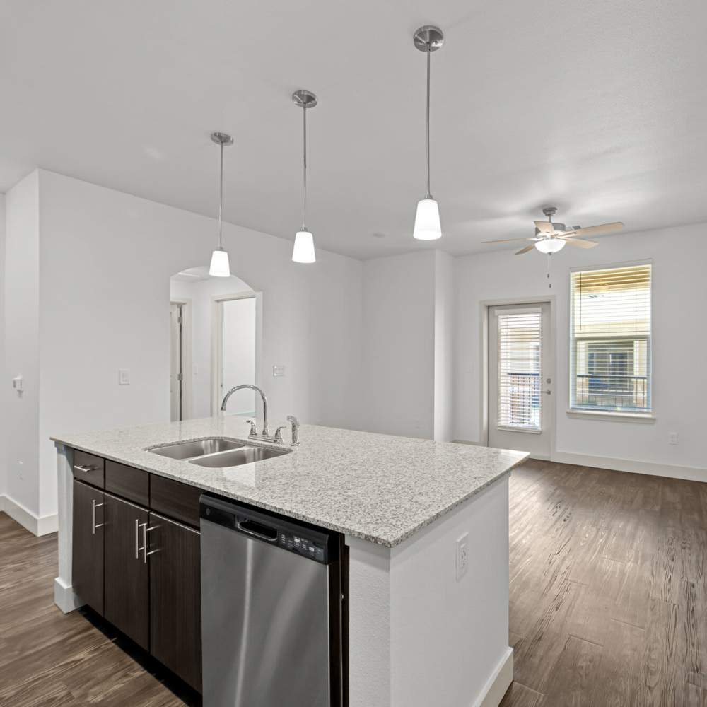 Spacious island kitchen with pendant lighting at Brook Hollow in Wichita Falls, Texas