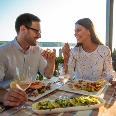 Residents enjoying dinner near Henley at The Rim in San Antonio, Texas