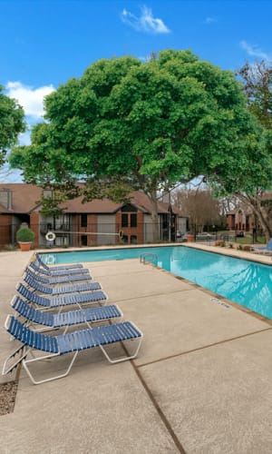 Swimming pool and lounge chairs at Pecan Ridge in Waco, Texas