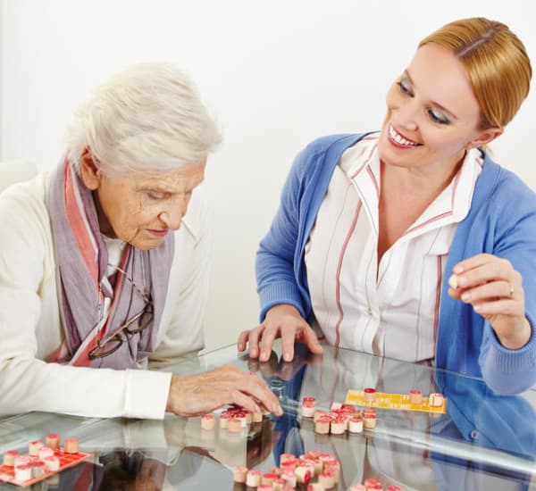 Resident enjoying one life enrichment activity at Heritage Oaks Assisted Living and Memory Care in Englewood, Florida