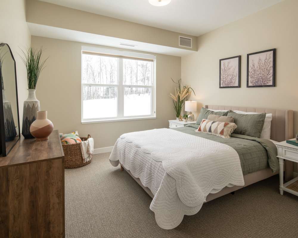 Cozy bedroom at The Pillars of Hermantown in Hermantown, Minnesota