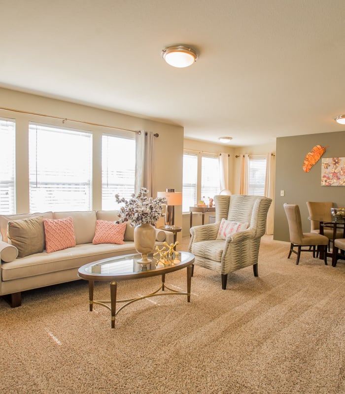 Carpeted living room at Icon at Broken Arrow in Broken Arrow, Oklahoma