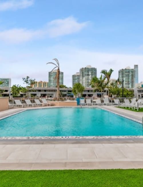 The resort-style swimming pool with a view of the city at Marina Del Viento in Sunny Isles Beach, Florida