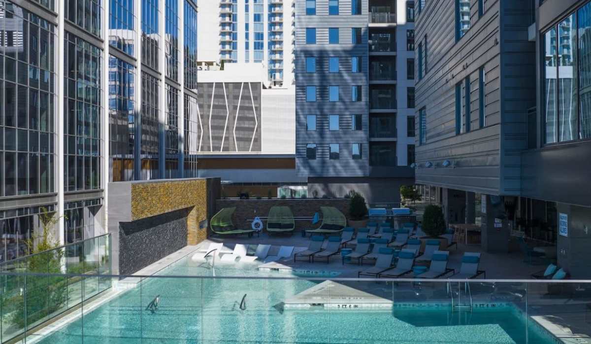 Spacious swimming pool with lounge beds at Novel Midtown in Atlanta, Georgia