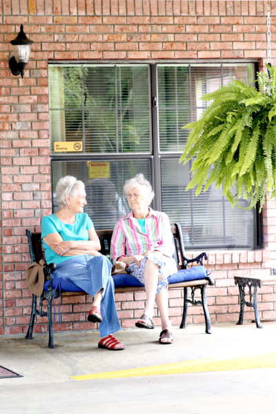 Two residents having a talk outside at Providence Assisted Living in Grenada, Mississippi. 