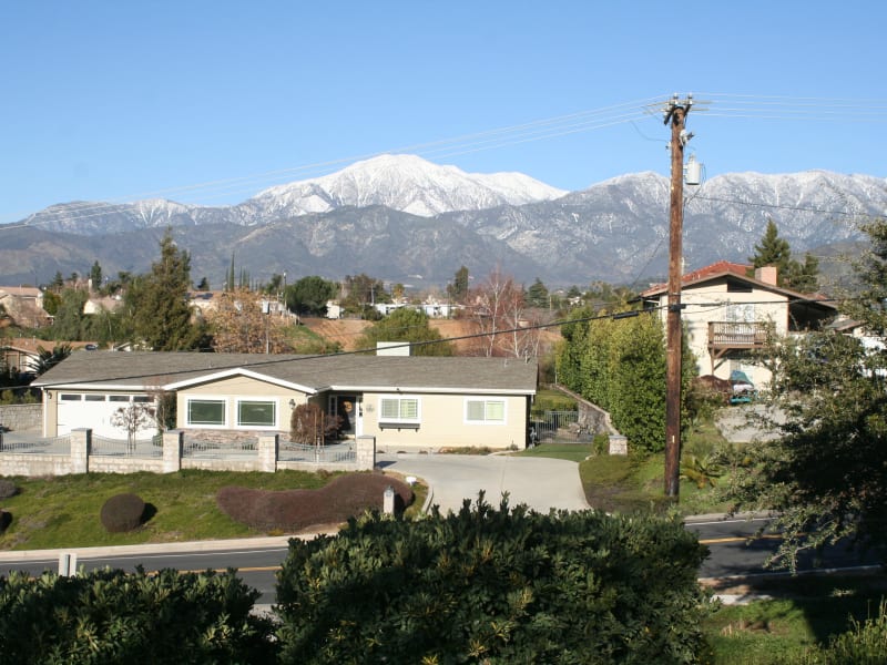 Exterior view with mountains at Wildwood Canyon Villa Assisted Living and Memory Care in Yucaipa, California