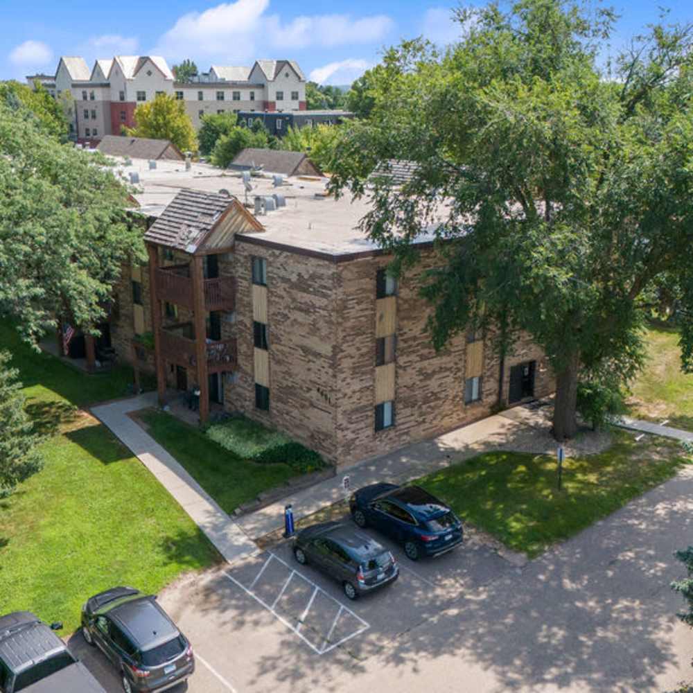 Apartment entry view showing road and parking at Solace on Lake Minnetonka in Spring Park, Minnesota