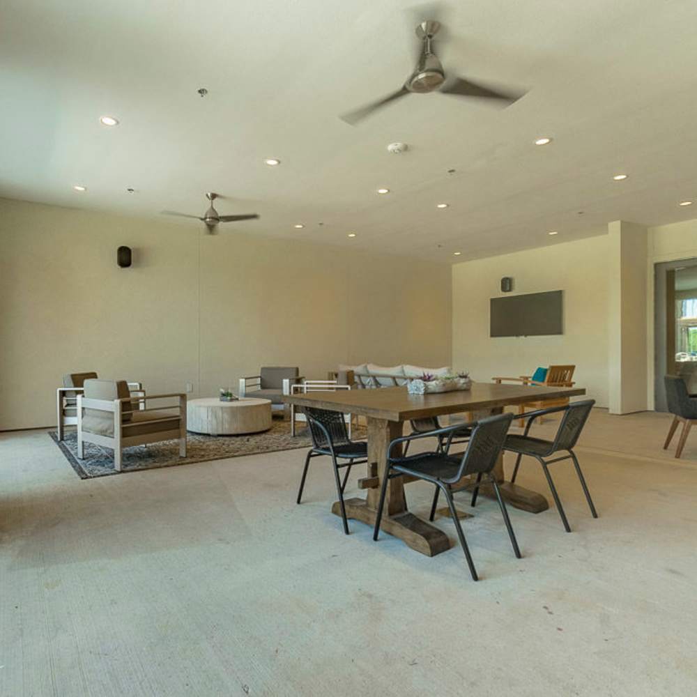 Spacious community seating area with ceiling fan at Millennium Place in Corinth, Texas