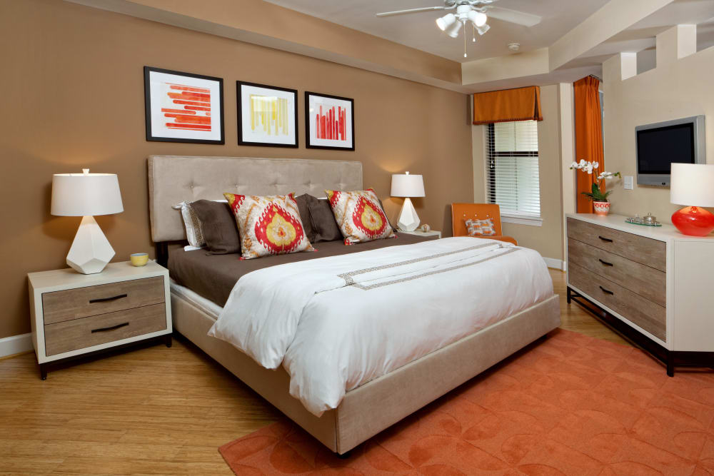 Model bathroom with ceiling fan and wood-style floors at Cielo in Charlotte, North Carolina
