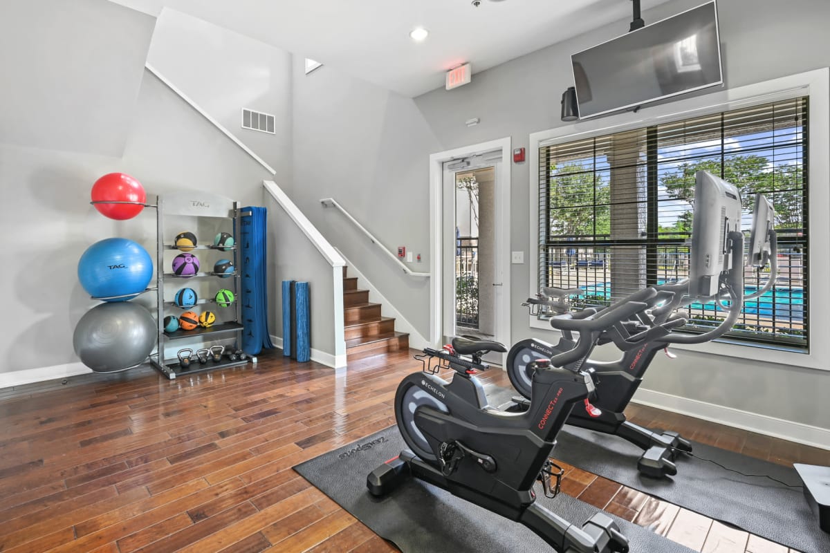 Fitness center with workout machines at The Cortona in Fairview, Texas