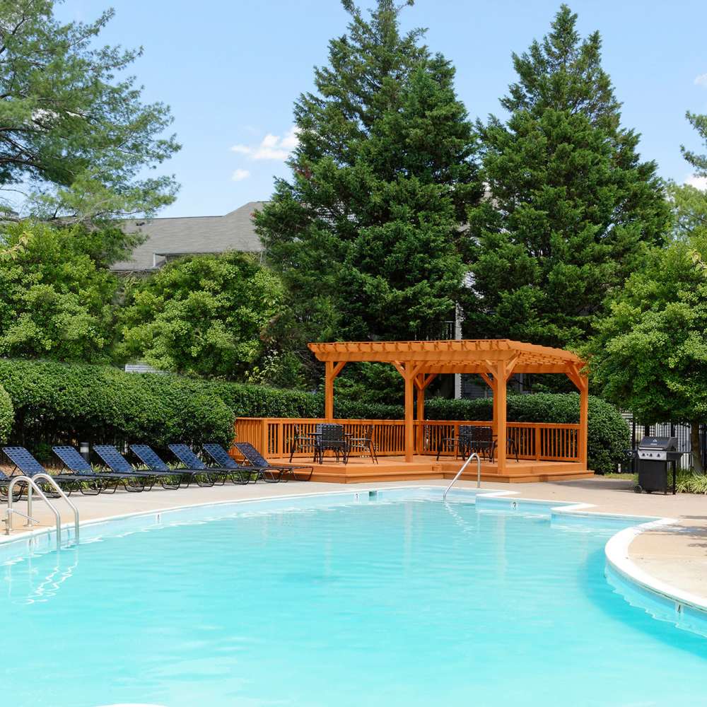 Swimming pool with lounge chairs at Chase Heritage in Sterling, Virginia