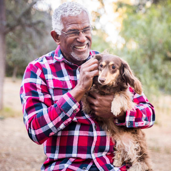 Resident enjoying time with his dog at Cascade Ridge in Tacoma, Washington