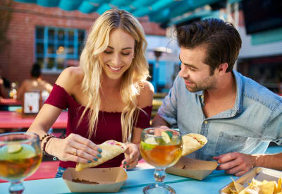 Resident couple enjoying drinks and a meal at their favorite restaurant near Broadstone Towne Center in Albuquerque, New Mexico