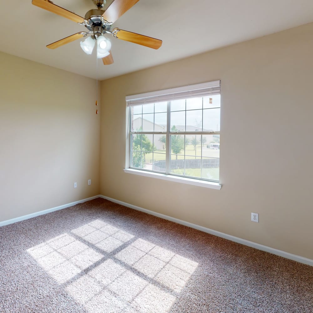 Open-concept layout with carpeted flooring throughout the bedrooms of a townhome at Oaks Estates of Coppell in Coppell, Texas