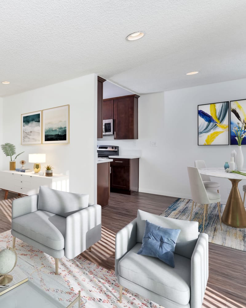 Well decorated model apartment with chairs and dining table at Villa Francisca, West Hollywood, California