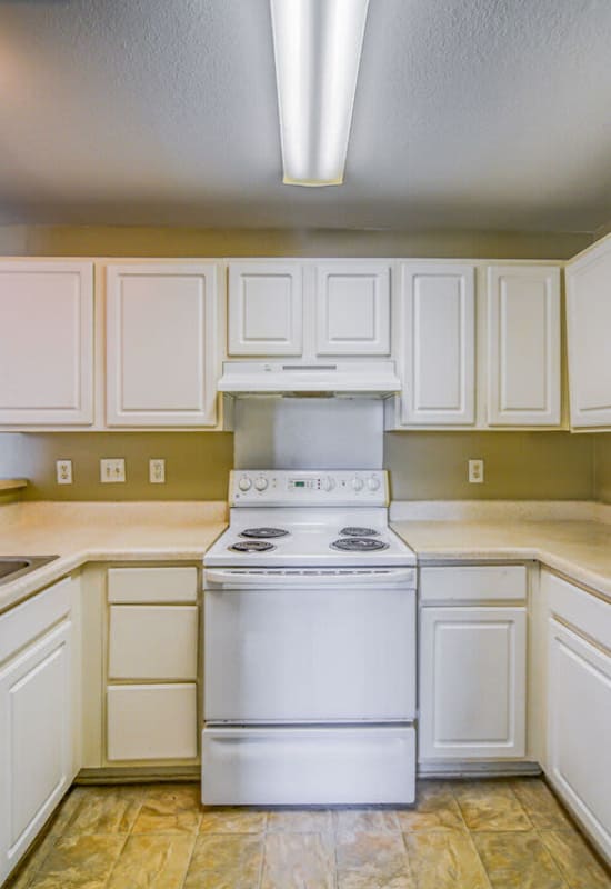 Model kitchen with gas range at The Landings at Houston Levee in Cordova, Tennessee