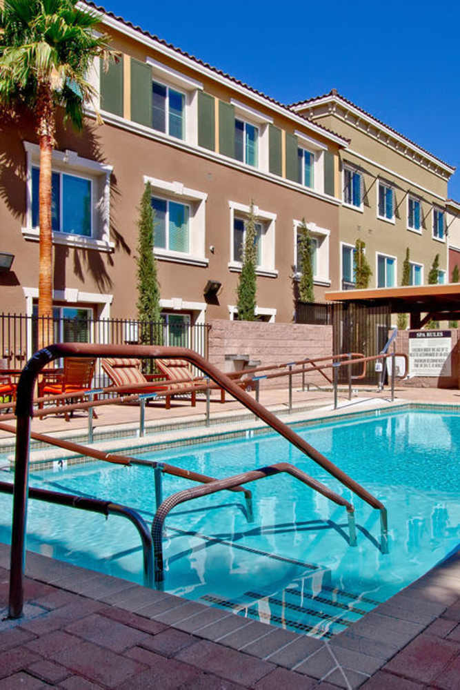 Swimming pool with lounge chairs at Acapella in Las Vegas, Nevada