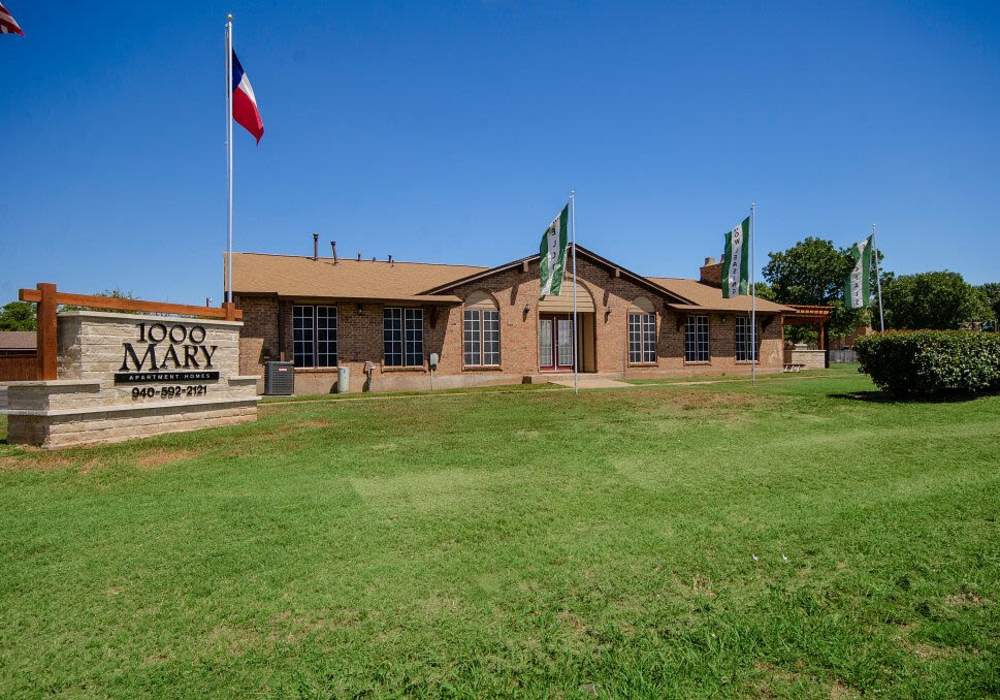 Apartment with property signage at 1000 Mary Apartment Homes in Iowa Park,Texas