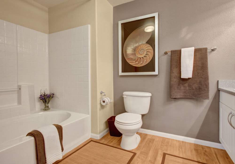 Bathroom with wood-style flooring and a tub at Rivers Edge in Lake Elsinore, California