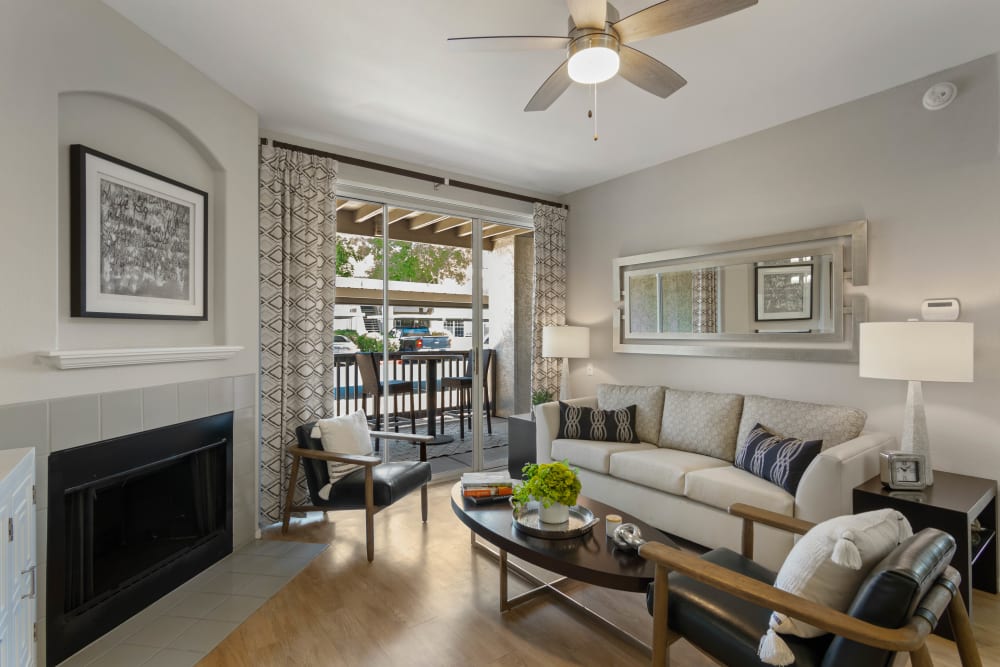 Living room featuring a fireplace at Sonoran Vista Apartments in Scottsdale, Arizona