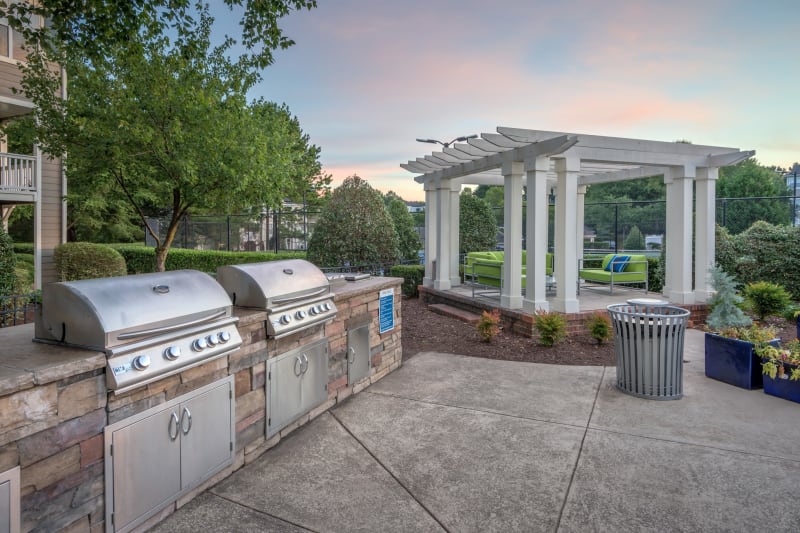 Barbecue area with gas grills overlooking the swimming pool at The Mark in Raleigh, North Carolina