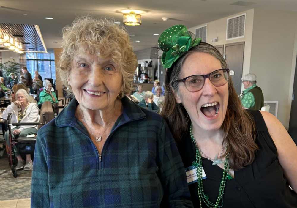 Residents having a good time in the community lounge at Merrill Gardens at Wright Park in Tacoma, Washington