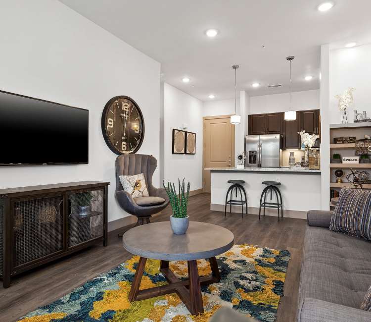 Model living room and breakfast bar at Villas at the Rim