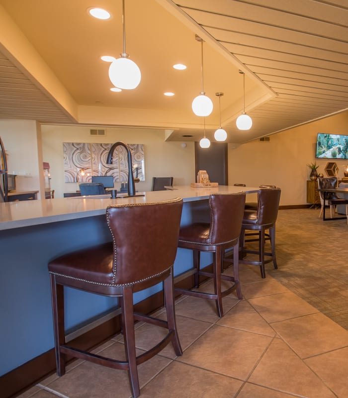Spacious clubhouse with bar seating at Sunchase Apartments in Tulsa, Oklahoma