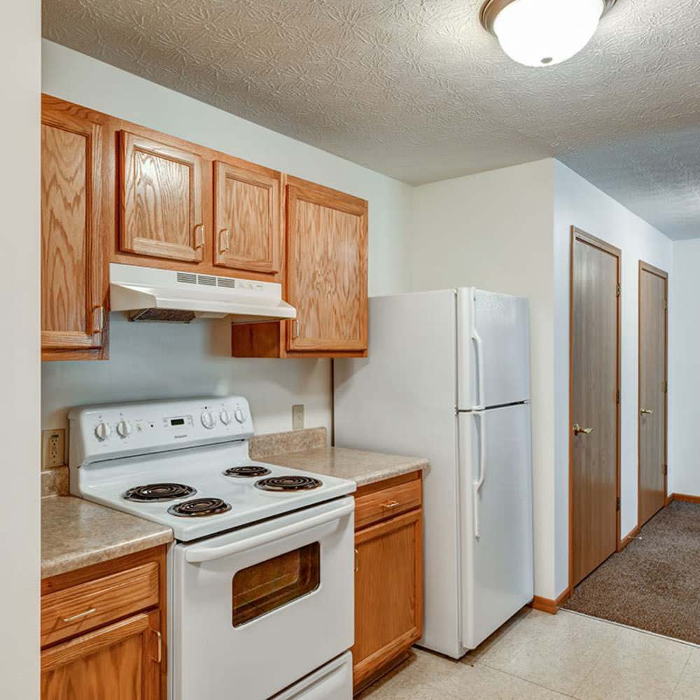 White stove with four burners and cabinets at Clover Ridge in McConnelsville, Ohio