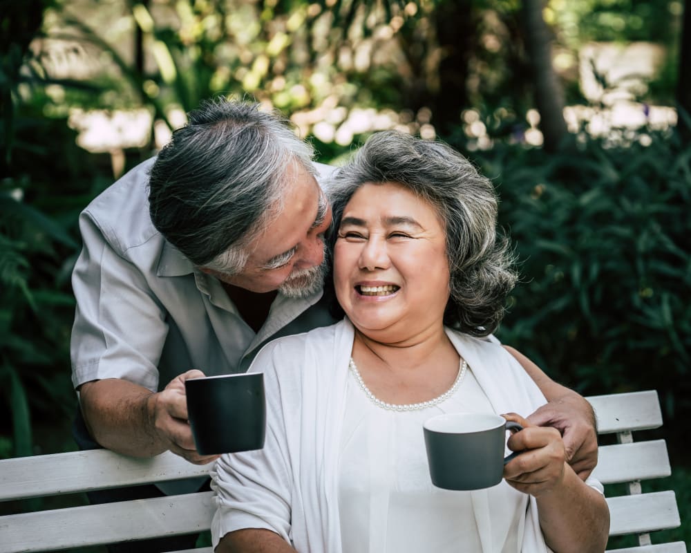 A resident couple enjoys coffee outside at Arlington Place of Pocahontas in Pocahontas, Iowa.