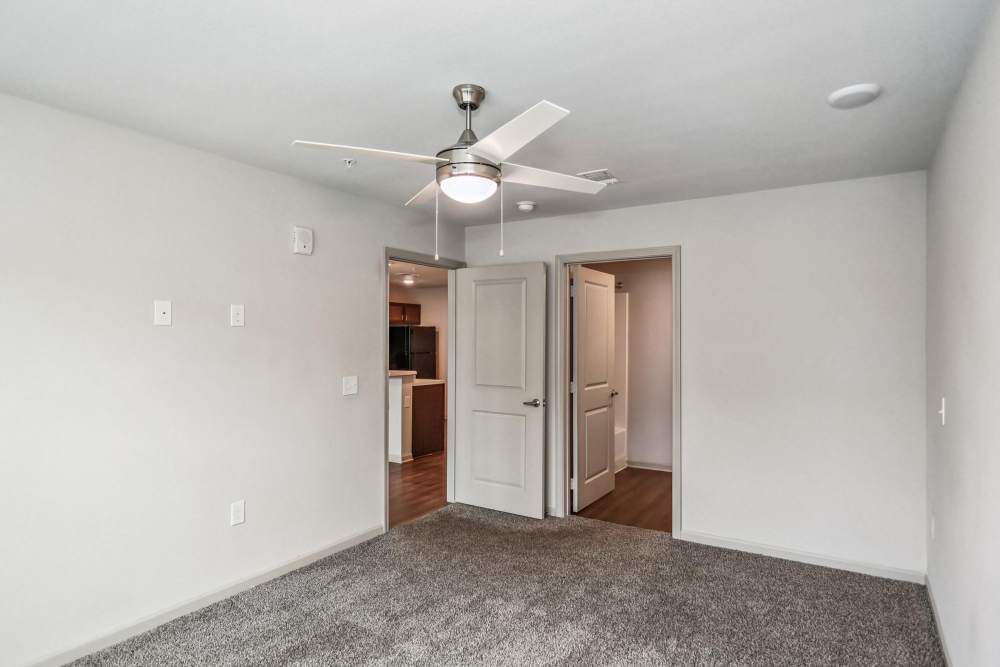 A well-lit bedroom with carpet floor at Flats at Mount Zion in Stockbridge, Georgia