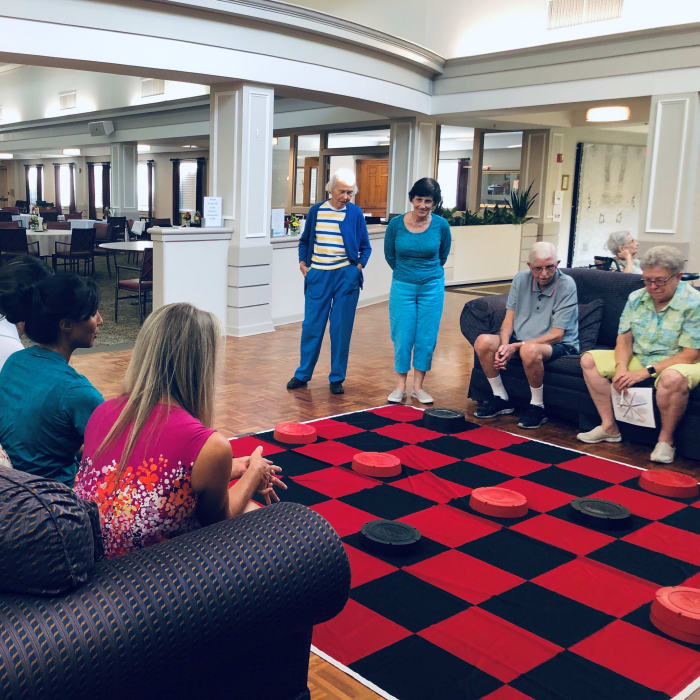 Residents playing giant checkers at The Foothills Retirement Community in Easley, South Carolina