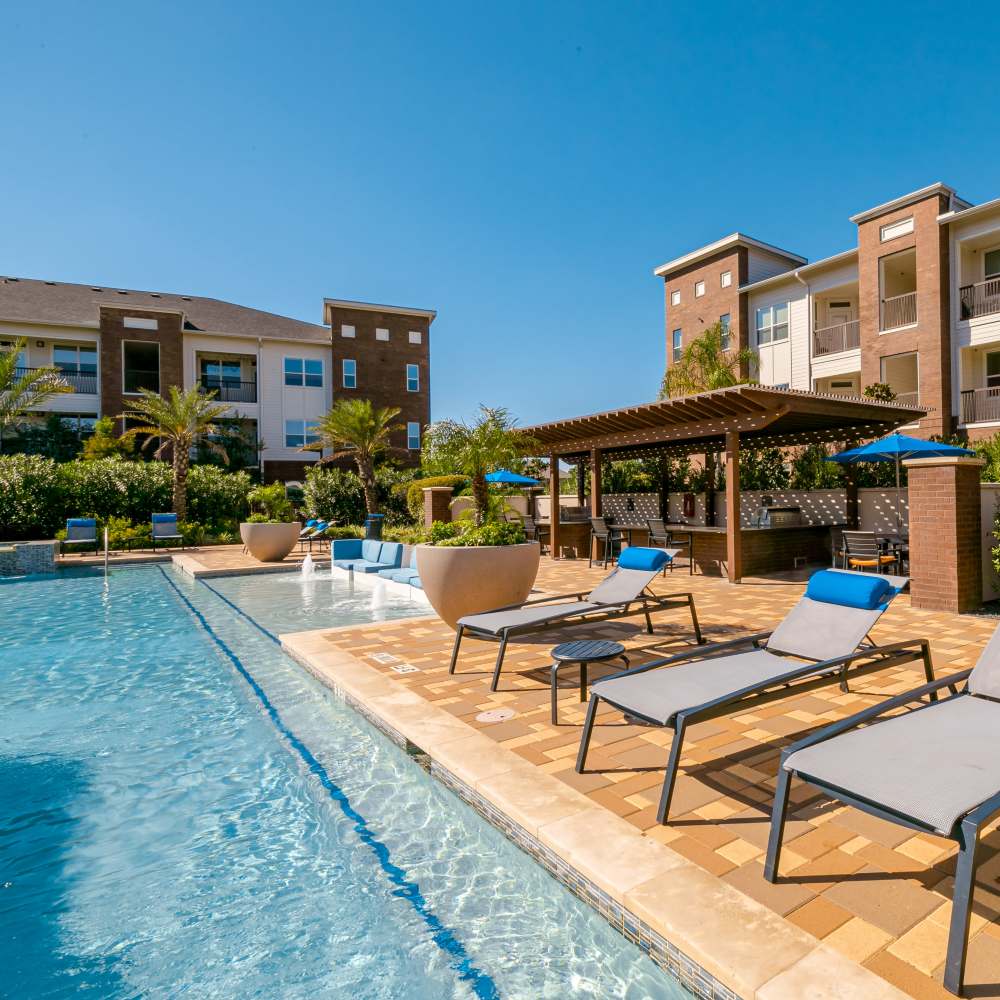 Sun loungers by the community swimming pool at NOVU New Forest in Houston,Texas