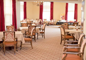 Interior view of the expansive and lavish grand dining room at Merrill Gardens at Solivita Marketplace in Kissimmee