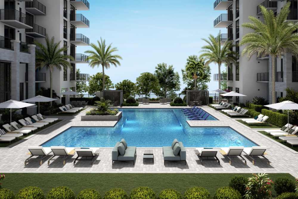 Swimming pool with lounge chairs at Bocora in Boca Raton, Florida