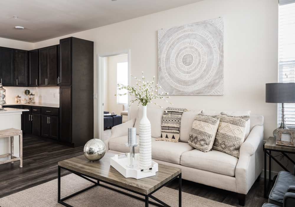 Living room with beautiful wall art at Altair At The Preserve in O'Fallon, Missouri