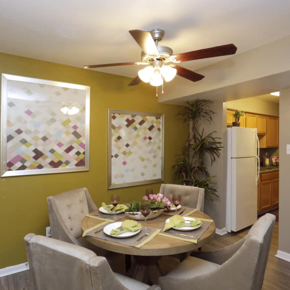Beautiful dining room with ceiling fan at EnVue Apartments in Bryan, Texas