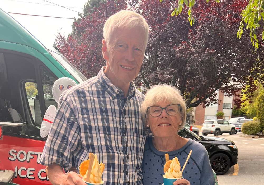 Residents holding up ice cream at Merrill Gardens at The University in Seattle, Washington