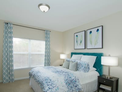 Well-lit bedroom at Apartments at the Venue in Valley